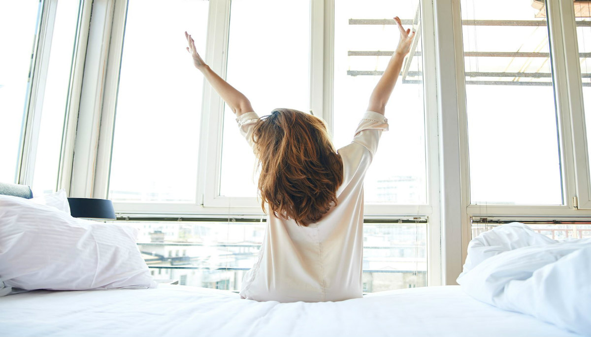 beautiful-woman-stretching-in-bed