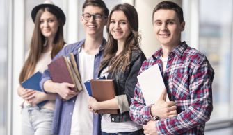 Group of happy young students in a university.