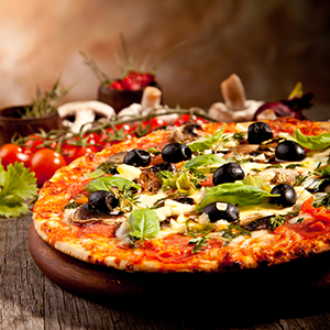 Delicious fresh pizza served on wooden table