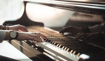 Woman playing a piano in music studio