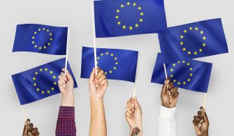 Hands waving flags of the EuropeanUnion