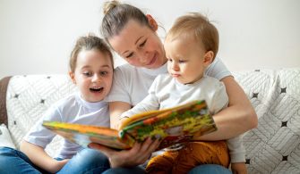 Mom and her daughter are playing together at home