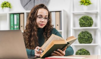 medium-shot-girl-studying-with-dictionary