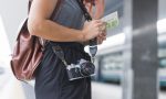 female-tourist-waiting-train