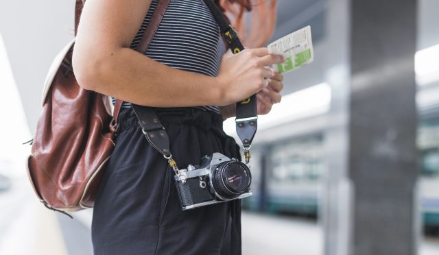 female-tourist-waiting-train