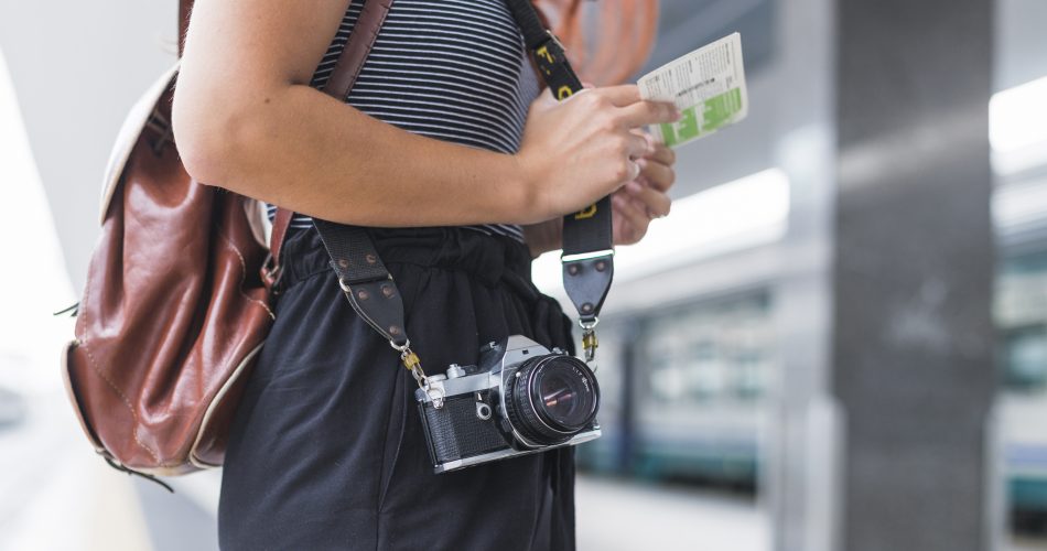 female-tourist-waiting-train