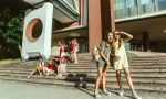 Happy kids playing at city's street in sunny summer's day