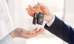 Stylish and elegant woman in a car salon
