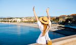 happy-elegant-woman-posing-back-put-her-hand-air-enjoying-amazing-view