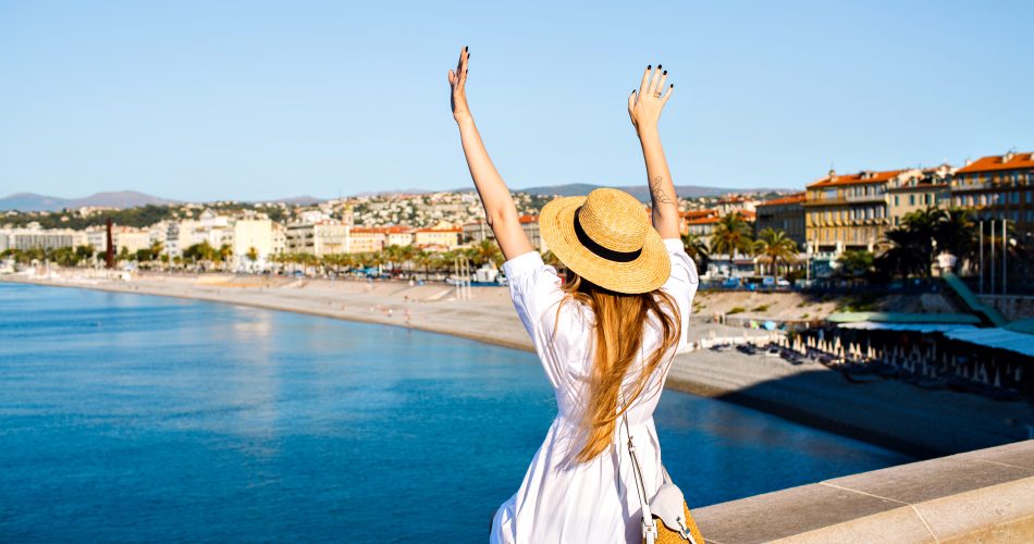 happy-elegant-woman-posing-back-put-her-hand-air-enjoying-amazing-view